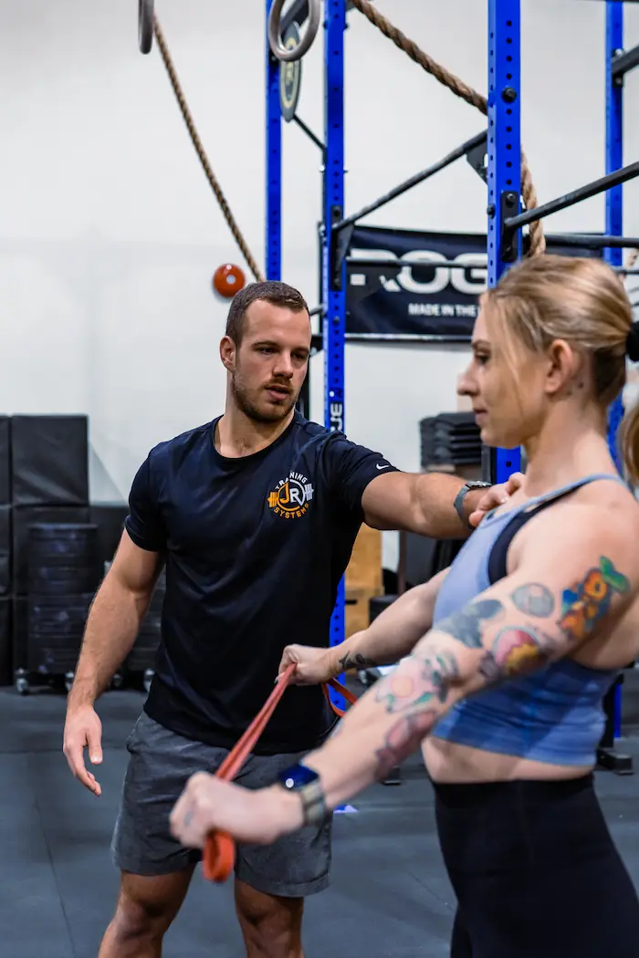 Client discussing fitness goals with a coach during a consultation on how to find a personal trainer
