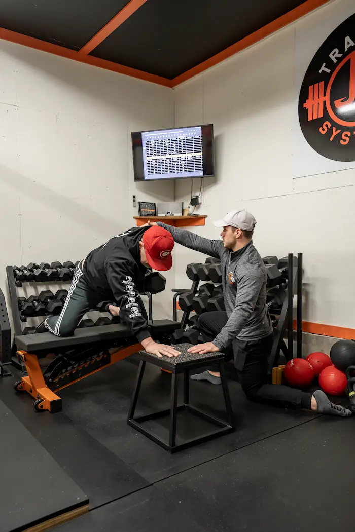 Jake Richardson coaching a client through a lift at the JR Training Systems studio in Kamloops