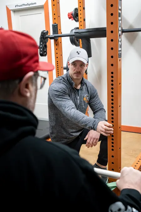 Jake Richardson explaining to client about the exercise