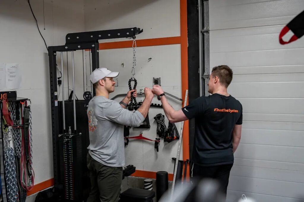 Kamloops personal trainer Jake Richardson with a client after a training session